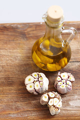 Image showing Olive garlic. Olive oil with garlic cloves.