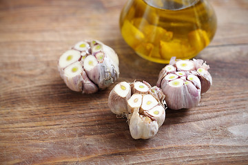 Image showing Olive oil with garlic cloves.