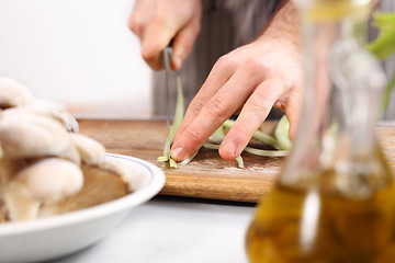 Image showing Cutting vegetables. Slicing knife vegetables.