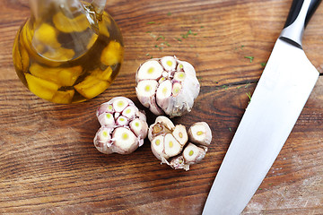 Image showing Olive oil with garlic cloves.