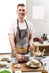 Image showing Cook. The young chef prepares a vegetable dish vegan 