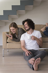 Image showing couple relaxing at  home with tablet computers