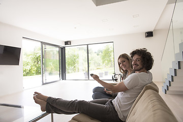 Image showing young couple relaxes in the living room