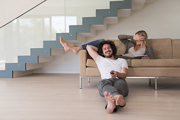 Image showing young couple relaxes in the living room