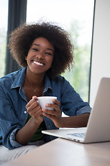 Image showing African American woman in the living room