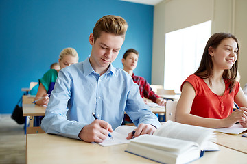 Image showing group of students with books at school lesson