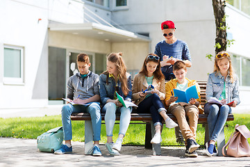 Image showing group of students with notebooks at school yard