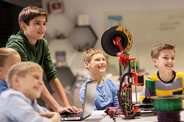 Image showing happy children with 3d printer at robotics school