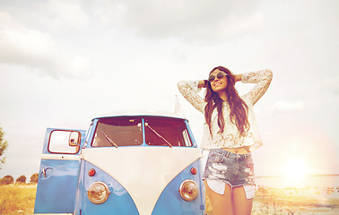 Image showing smiling young hippie woman in minivan car