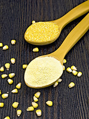 Image showing Flour and cereals corn in spoon on dark board