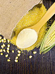 Image showing Flour corn in spoon with grains on board top