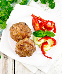 Image showing Cutlets stuffed with basil in plate on board top