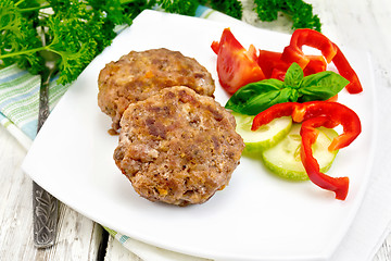 Image showing Cutlets stuffed with basil on light board