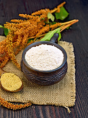 Image showing Flour amaranth in clay cup with flower on sackcloth