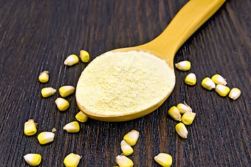 Image showing Flour corn in spoon on dark board