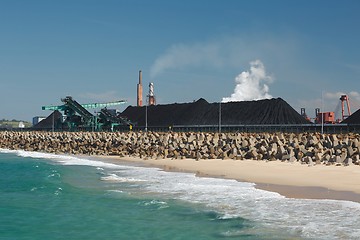 Image showing Coal piles at the seaside