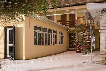 Image showing Type in the winter on a small two-story guest house