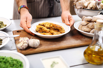 Image showing Oyster topped with bread crumbs a puree of green peas