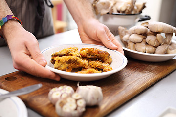 Image showing A dish of oyster mushrooms. Vegan dish. Oyster topped with bread crumbs a puree of green peas 