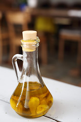 Image showing Olive oil with garlic cloves.