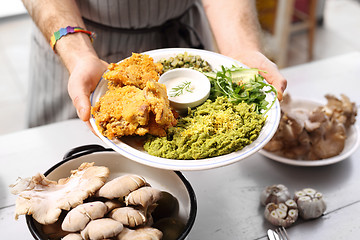 Image showing Oyster mushrooms coated in breadcrumbs. Vegan dish.