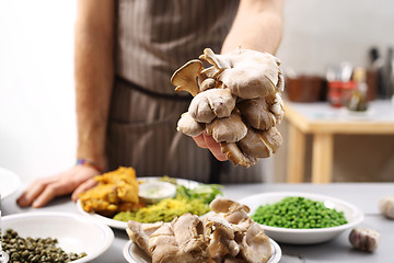 Image showing Oyster mushrooms mushrooms and olive oil.