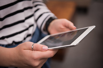 Image showing female hands working with tablet computer