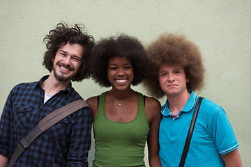 Image showing multiethnic group of happy three friends