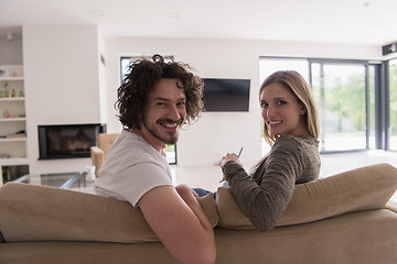 Image showing Rear view of couple watching television