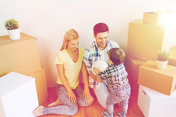 Image showing happy family moving to new home and playing ball