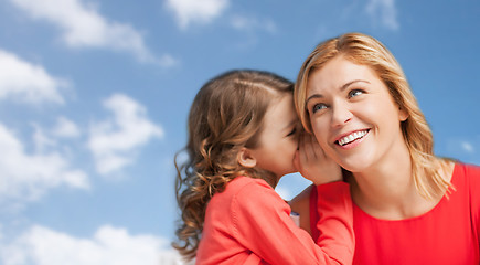 Image showing happy mother and girl whispering into ear