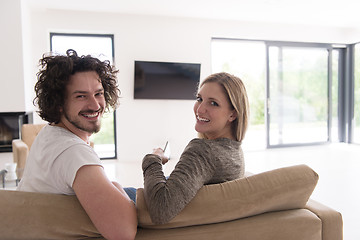 Image showing Rear view of couple watching television