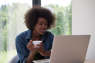 Image showing African American woman in the living room