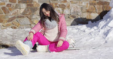 Image showing Young asian snowboarder girl relaxing