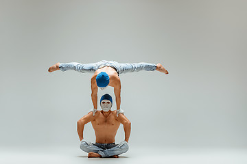 Image showing The two gymnastic acrobatic caucasian men on balance pose