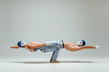 Image showing The two gymnastic acrobatic caucasian men on balance pose