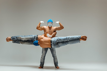 Image showing The group of gymnastic acrobatic caucasian men on balance pose