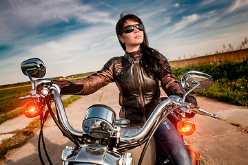 Image showing Biker girl on a motorcycle