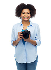Image showing happy african american woman with digital camera