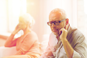 Image showing senior couple sitting on sofa at home