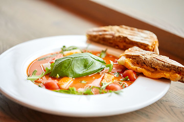 Image showing close up of gazpacho soup with bread at restaurant