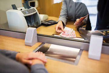 Image showing clerk counting cash money at bank office