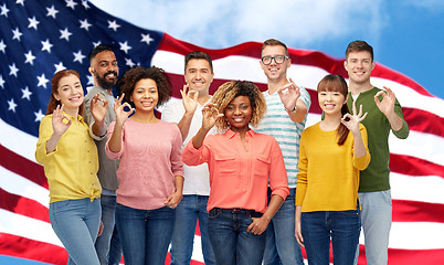 Image showing international people showing ok over american flag