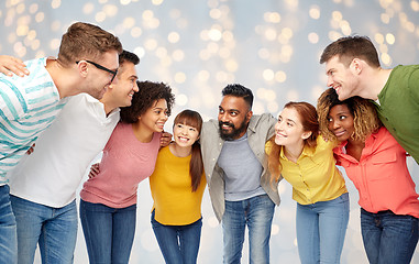 Image showing international group of happy people over lights