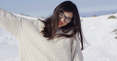 Image showing Happy young woman in snowy landscape