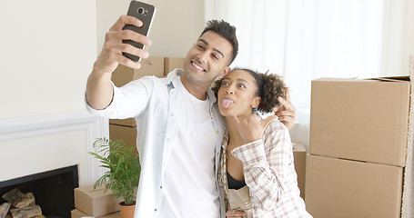 Image showing Fun young couple taking their selfie