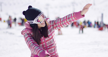 Image showing Happy woman on ski holiday waving