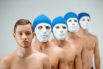 Image showing The people in masks and one man without mask