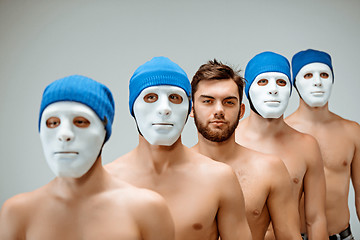 Image showing The people in masks and one man without mask