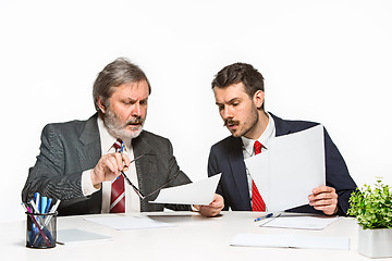 Image showing The two colleagues working together at office on white background.